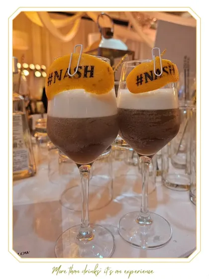 Our signature Espresso Cocktail, garnished with a custom hashtag printed on a dehydrated orange slice. It's a perfect blend of delicious flavor and Instagram-worthy presentation.