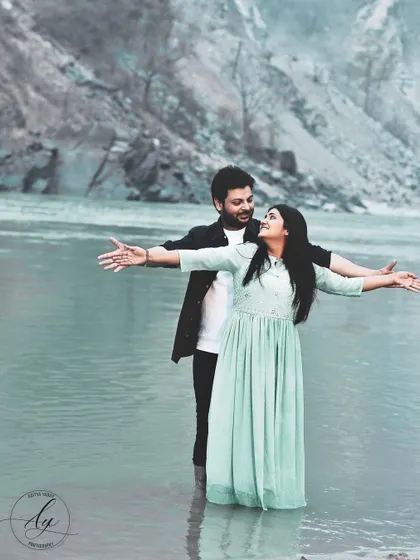 Recreating the iconic Titanic pose in the serene waters of the Ganges in Rishikesh. This destination pre-wedding photo is both playful and romantic, showcasing the couple's adventurous spirit.