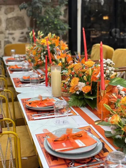 The full tablescape, showing how the colors, flowers, and candles come together to create a luxurious dining experience.