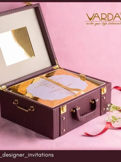 Celebrate a milestone anniversary with an invitation that is also a timeless gift. This briefcase-style invitation box combines luxury and utility, designed as a beautiful keepsake that reflects the importance and grandeur of the occasion.
