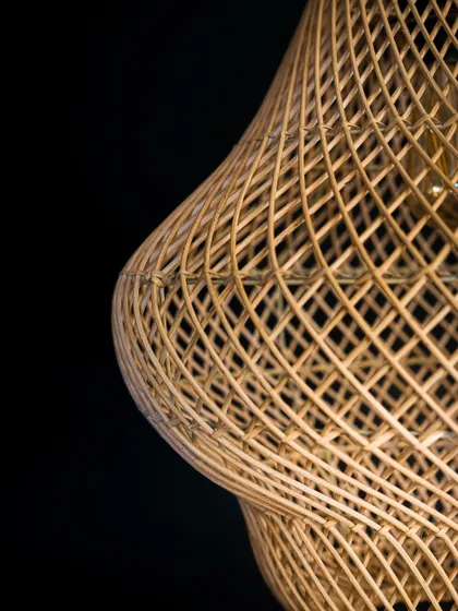 Another close-up of the gourd lamp's surface, showing the subtle undulations and the precision of the hand-woven rattan.