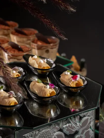 A close-up of our savory cannoli appetizers at a Diwali party. These innovative bites are an example of how we blend different culinary traditions to create unique flavors.