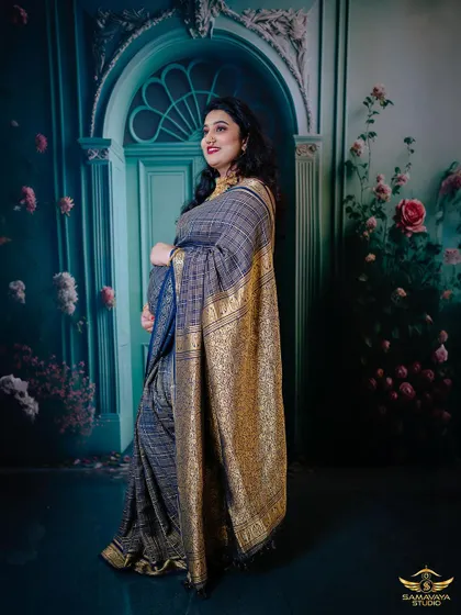 A duplicate of 129, this image showcases the elegance of a traditional saree against a beautifully artistic studio background.