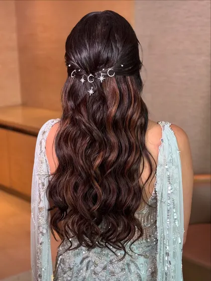 Let's make your hairstyle magical. For this dreamy reception look, I styled the hair in soft waves and added these whimsical moon and star charms. It’s a unique way to personalize your style and add a touch of celestial sparkle to your special night.