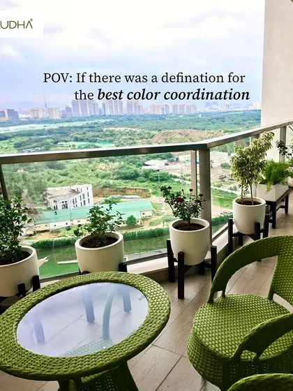 Because we like our balcony just like our view: lush, green, and full of life. This design features bright green furniture that complements the stunning natural view and the row of potted plants.