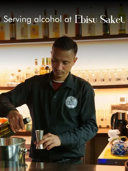 Our bartender at work. We are happy to announce that we now serve a full range of alcoholic beverages, including fine sake and Japanese whisky, at our Saket location.
