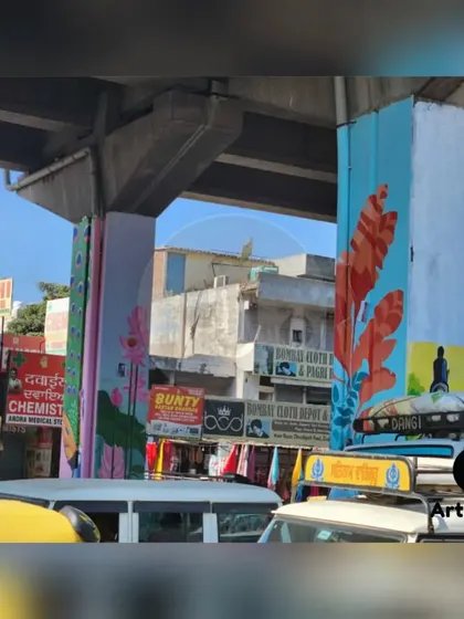 Another view of the painted pillars, showing how the different designs and colors come together to create a vibrant and cohesive public art installation.