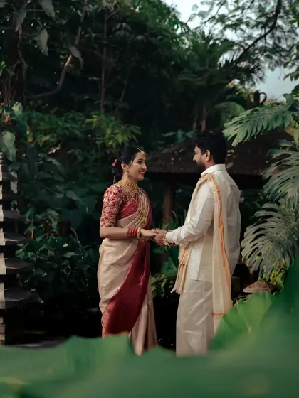 A series of photos from a post-wedding shoot in a lush, tropical garden. The couple's traditional attire looks stunning against the vibrant greenery.