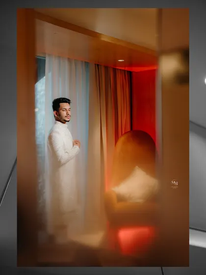 A creative groom's portrait using a frosted glass effect. This artistic technique adds a dreamy and mysterious quality to the image.