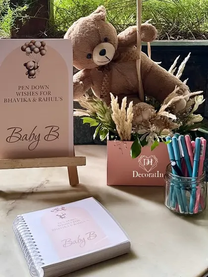 A "Pen Down Wishes" station, where guests can write heartfelt messages for the baby in a keepsake book.