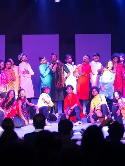Gratitude in lights. A shot of the audience and performers at Allstars Night. Your support fuels the passion of our entire student body.