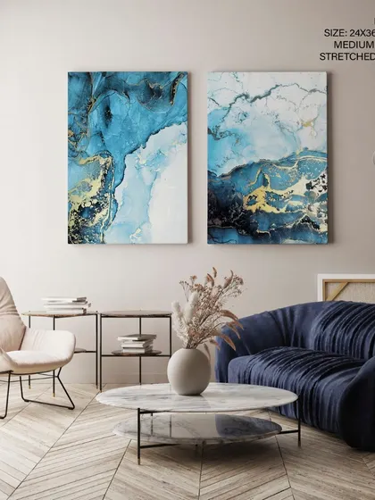 A view of our two-piece abstract art set as stretched canvases. This frameless option offers a pure, uninterrupted display of the fluid indigo and gold patterns, perfect for a contemporary space.