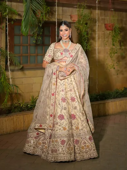 A full-length shot showing the beautiful movement of the lehenga. The makeup is designed to be stunning from afar, creating a cohesive and elegant silhouette.