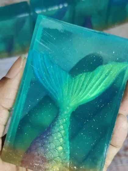 Imagine creating a soap so clear it looks like glass. In my specialty masterclass, I teach a unique and quick method to make your own transparent soap base from scratch, using only skin-safe ingredients. This opens up a world of creative possibilities, like these magical mermaid soaps.