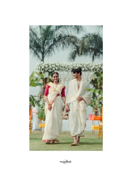 The couple taking their first walk together as husband and wife, framed by the beautiful outdoor wedding setting.