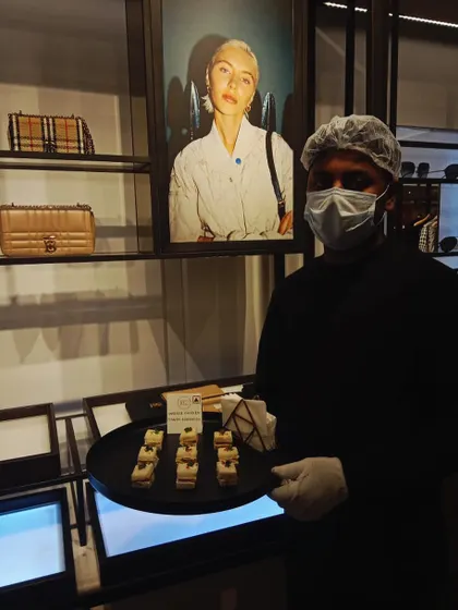 Providing discreet and elegant service at a private event for the luxury fashion house, Burberry. Our staff is trained to operate seamlessly within exclusive retail environments, serving gourmet bites to VIP clients.