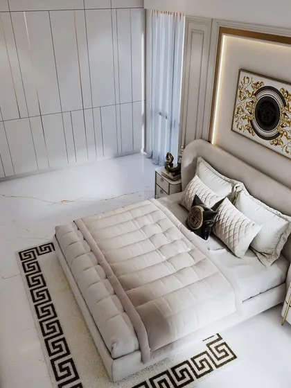 A 3D render of a bedroom blending luxurious modern design with timeless neoclassical charm. The space features soft neutrals, Versace-inspired gold accents, and a Greek key rug.
