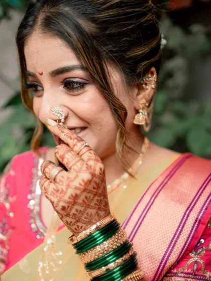 A playful and happy moment with my bride Shreya during her vidhi ceremony, highlighting her intricate nath and mehndi.