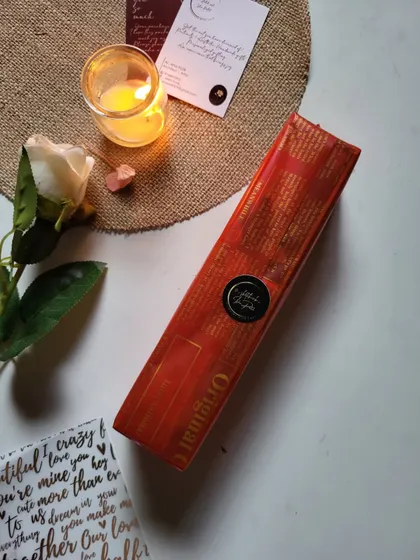 A beautifully wrapped scroll letter box. The vintage newspaper wrapping and simple seal add to the anticipation of opening it.