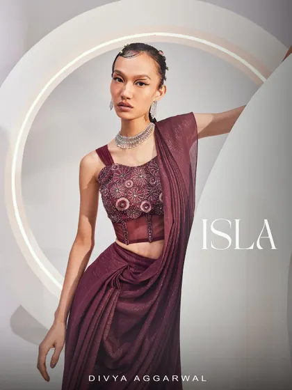 A portrait in the ISLA Saree Set, highlighting the unique silhouette and rich color, perfect for a modern festive look.