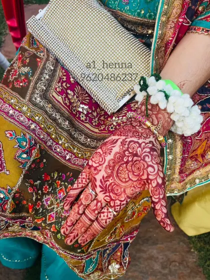 Another look at the deep, rich color of a mature henna stain, showing its beauty against a colorful outfit.
