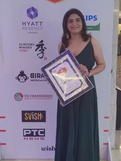 Posing with my Top 5 Homebaker award. This recognition fuels my passion for creating delicious and beautiful cakes for all your special occasions.