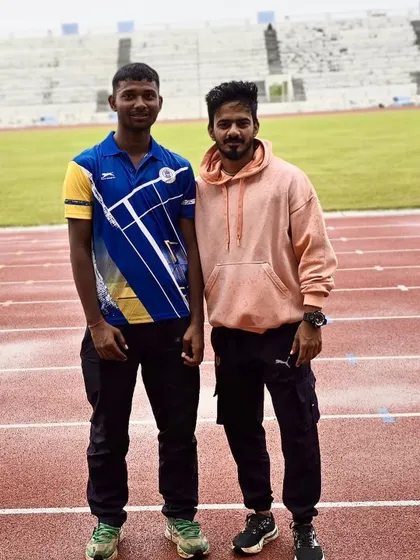 Double gold for Mohit. Pictured here with his coach on the track, Mohit dominated the T12 category, winning both the 200m and 400m sprints through sheer speed and determination.