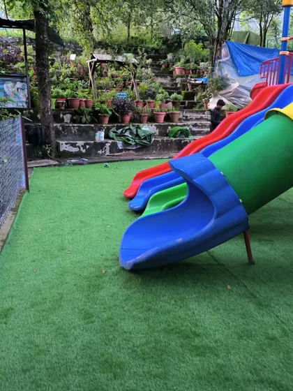 The base of the slides now has a soft landing. Parents don't have to worry about scraped knees or muddy clothes with this kind of playground flooring.