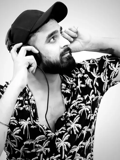 A black and white shot for a more artistic and timeless feel. My style is versatile, just like my music.