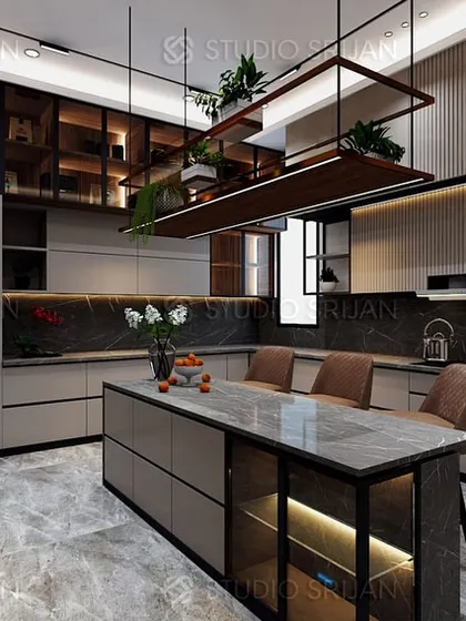 A kitchen should be the functional heart of the home. This modular kitchen in Gurgaon features a central island with seating, state-of-the-art integrated appliances, and ample storage, all tied together with a sophisticated dark marble and neutral cabinetry design.