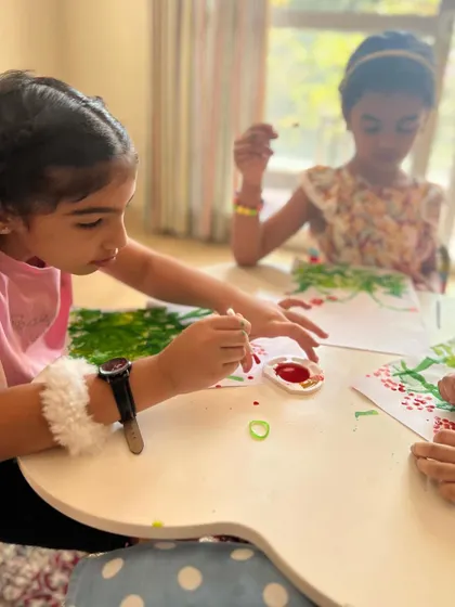 Little artists focused on their sponge painting project. This technique is great for all ages and creates a lovely, soft effect for foliage and flowers.