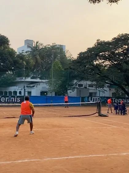 A wide shot of a doubles match at the TTPL in December 2022. The clay courts provide a professional surface for high-level competitive play.