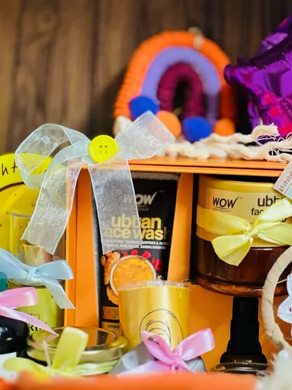 This shot highlights the pampering items for the mom-to-be, including WOW Skin Science face wash and ubtan face pack, perfect for a relaxing self-care session.