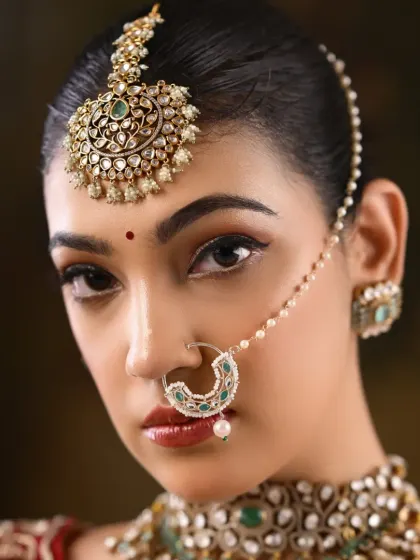 A detailed shot of the eye makeup, showing the sharp winged liner and perfectly defined brows.