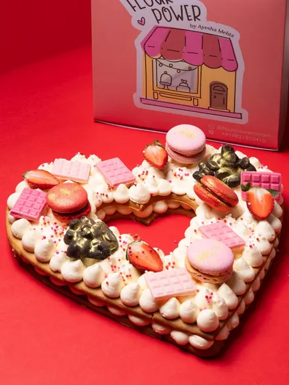 Say it with a tart. My 'Only Love Tart' is a heart-shaped shortbread cookie layered with luscious cream and decorated with macarons, fresh strawberries, and chocolate. It's a beautiful and delicious centerpiece for Mother's Day, anniversaries, or Valentine's Day.