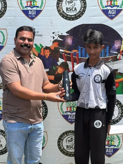 A player is awarded for his performance in front of the official RSCA League backdrop.