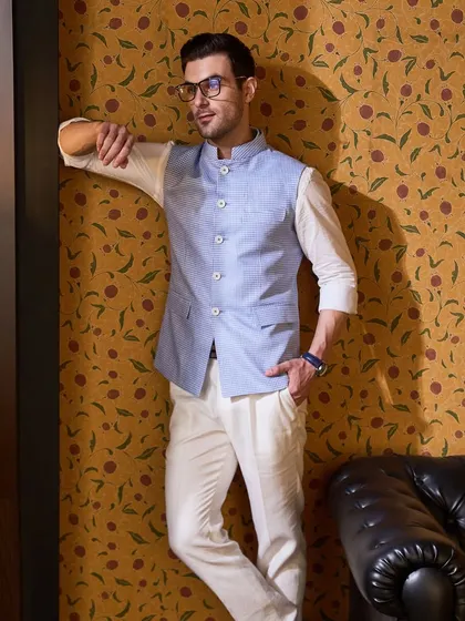 This pastel blue waistcoat paired with a crisp white linen shirt and chinos is perfect for a summer evening. I tailor each piece to your specific fit to declare this summer a sartorial season.