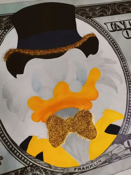 Adding the glitter to Scrooge's bow tie. It's all in the details.