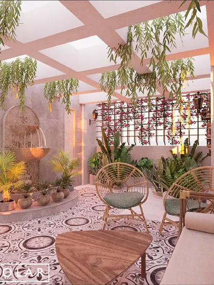 The terrace of the La Lagune Penthouse is a peaceful oasis in the city. We used patterned tiles, rattan furniture, and a serene water fountain to create a space perfect for unwinding.