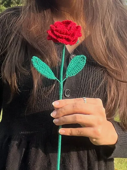 A single, perfect red rose. Sometimes, one flower is all you need to say everything. This is our classic single-stem crochet rose.