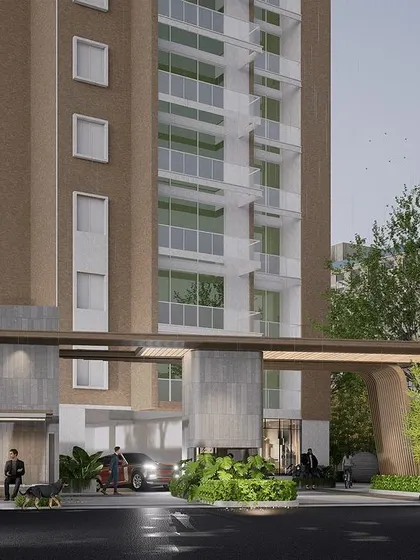 For this apartment building in Bengaluru, the design emphasizes green pockets and sculptural elements to create focal points. The entrance gate is designed with a modern, minimalist aesthetic, directing attention to the intricate details.