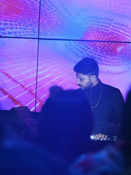 In the zone, mixing tracks with a backdrop of custom visuals. The LED screen is my canvas, and I use it to create a unique visual theme for each party, from abstract patterns to personalized wedding content.