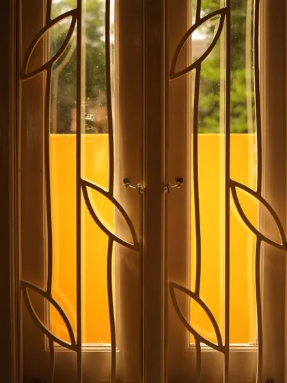 A repeat of the custom window grill detail, emphasizing the craftsmanship.