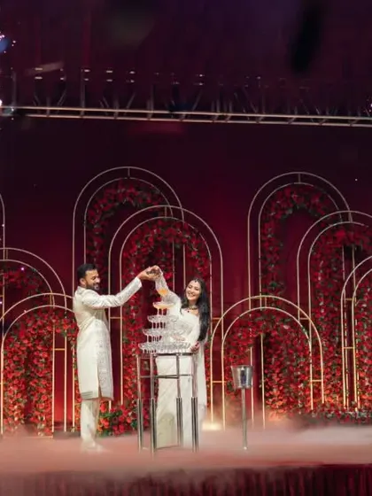 Our team coordinating a grand champagne tower moment for the couple on stage, complete with cold pyro effects.