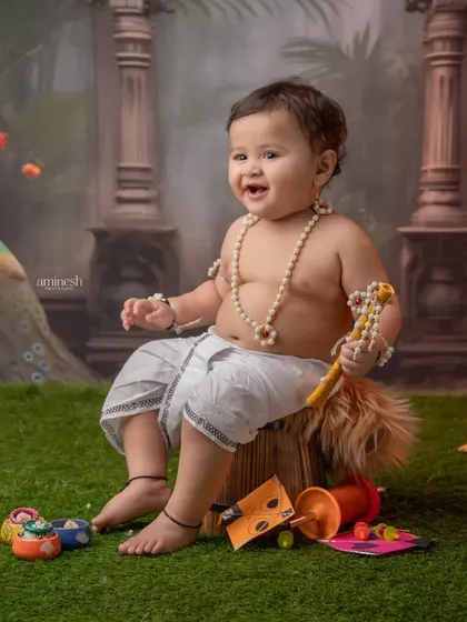An adorable, happy baby celebrating the festival of kites. I focus on capturing these joyful, candid moments that you will cherish forever.