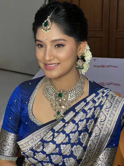 A beautiful portrait that captures the bride's serene elegance. The makeup is understated and sophisticated, a testament to the "less is more" approach.