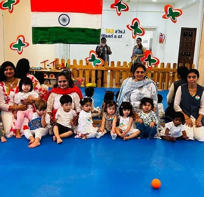 A group photo of our students and teachers celebrating Indian Independence Day, dressed in the colors of the flag.
