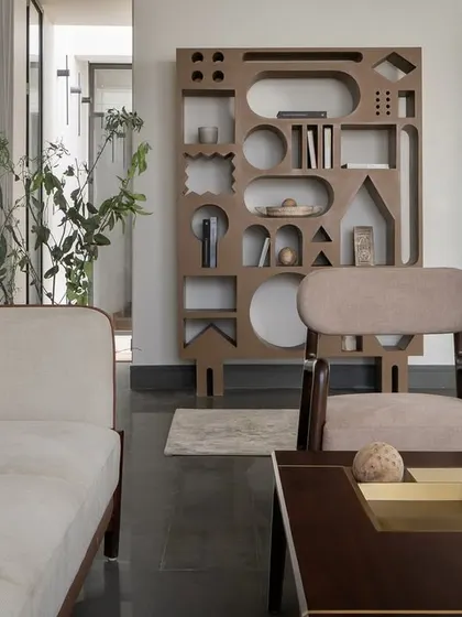 Even restraint can have character. In our compact Hikari House project, we designed this sculpted bookshelf from waste wood, turning leftover material into an interactive feature that brings a touch of whimsy and proves that resourcefulness can be expressive.