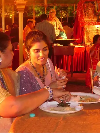 Happy guests enjoying the food and conversation at a royal wedding. My aim is to provide a culinary experience that enhances the joy of the occasion.