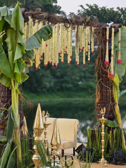For this South Indian wedding, we designed a rustic-luxe mandap using banana leaves, woven vines, and hanging tuberose garlands. The design honors tradition while feeling fresh and integrated with the natural surroundings.